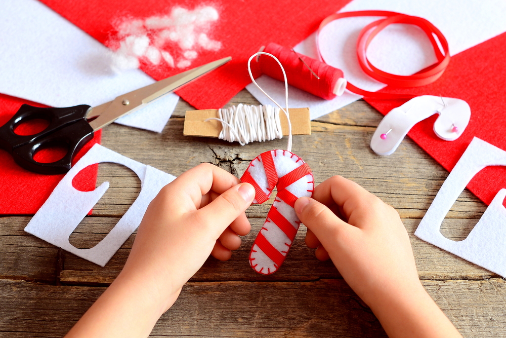 Child-making-candy-cane-ornament