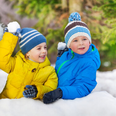 Kids holding snowballs
