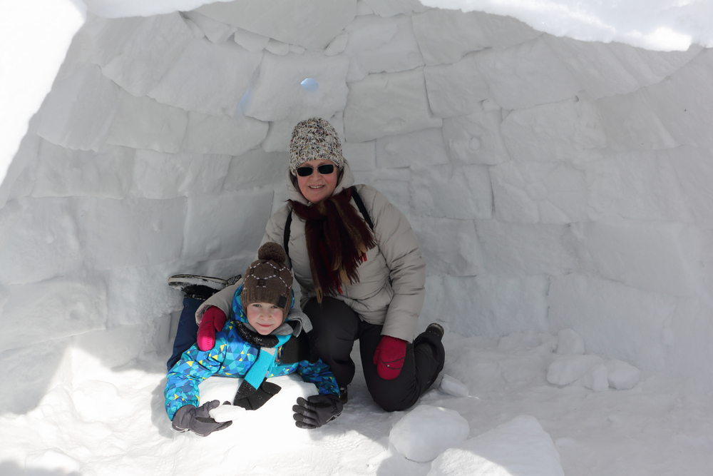 Mom and boy in igloo