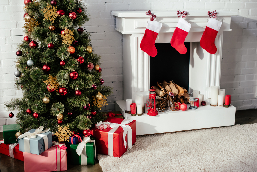 Presents-under-Christmas-tree-by-fireplace